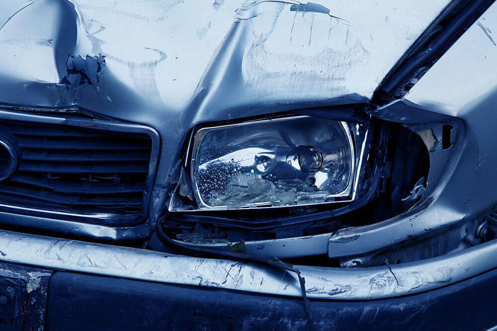 car with with broken light and damage