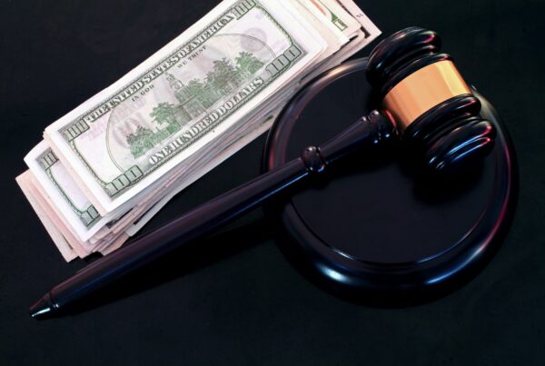 Gavel with a pile of money